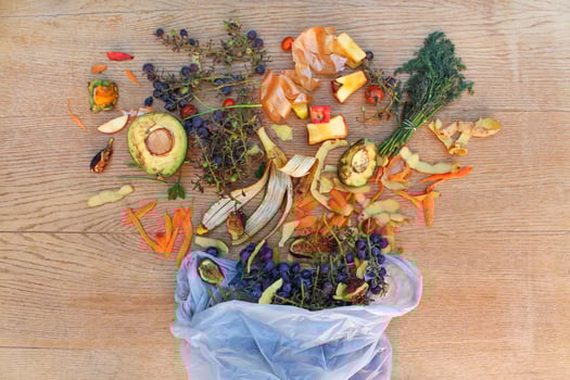 Domestic waste for compost from fruits and vegetables in the garbage bag on the table. Top view. photo