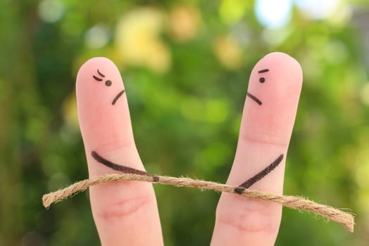 Fingers art of couple. They playing tug of war with rope. photo