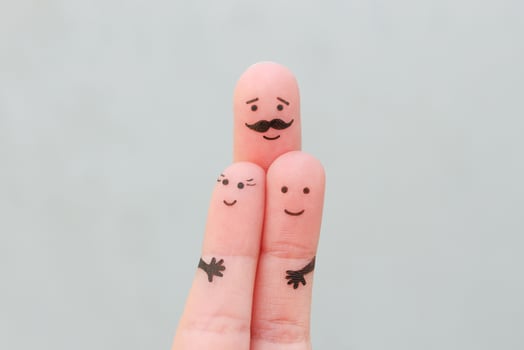 Fingers art of happy family. Concept father hugs children. photo