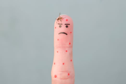 Finger art of man. Concept of human was bitten by mosquito. photo