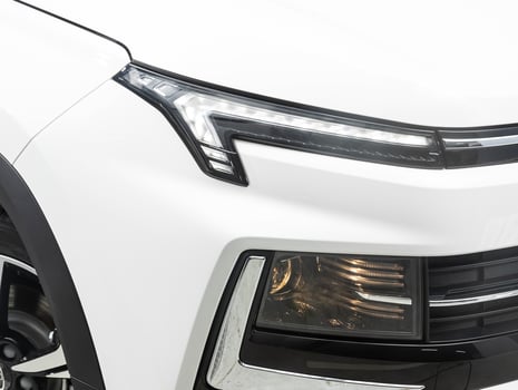 view of the front  of the car. White  car headlight. photo