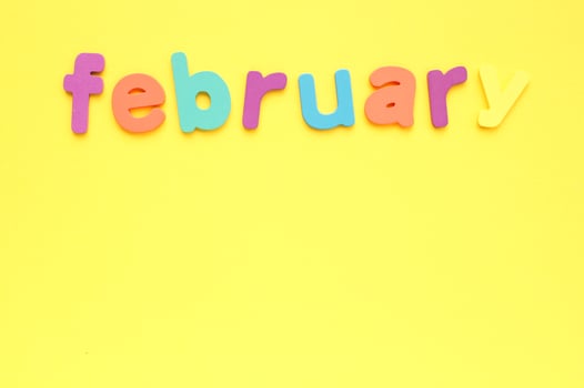 Calendar february list, daily planner for wall and desk on yellow background. To do, check list. Organizer, notebook with copy space. Business concept. Plan, action text. Schedule for month photo