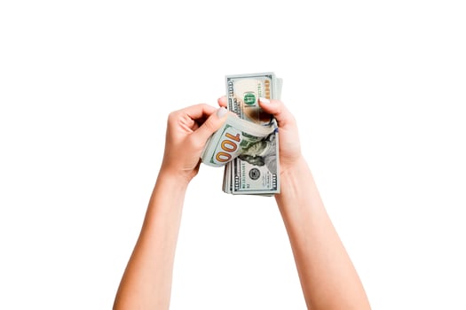 Top view of female hands counting dollar banknotes on white isolated background. Investment and prosperity concept photo