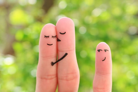 Fingers art of happy family. Concept of couple kisses, child glances after them. photo