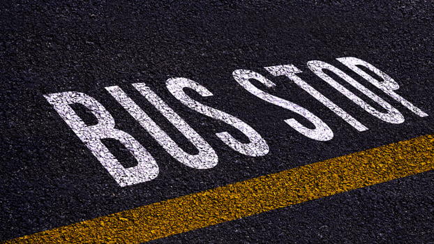 Bus stop text written and yellow line on the road in middle of the asphalt road, Bus stop word on street. photo