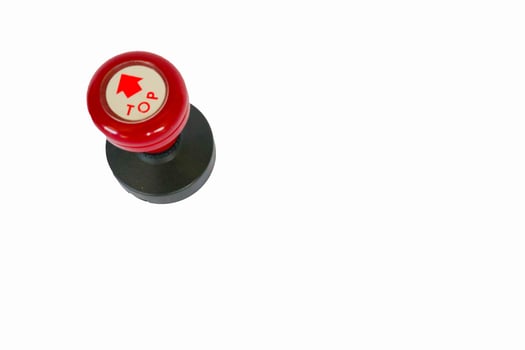 Stamp, modern Stamp, Red Handle Rubber Stamp Top View Isolated on White Background. photo