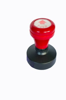 Stamp, modern Stamp, Red Handle Rubber Stamp Top View Isolated on White Background. photo