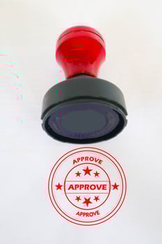 Stamp, modern Stamp, Red Handle Rubber Stamp Top View Isolated on White Background. photo