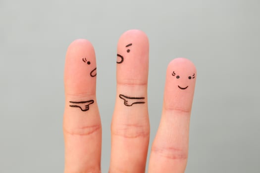 Fingers art of couple during quarrel. Another woman is happy. photo