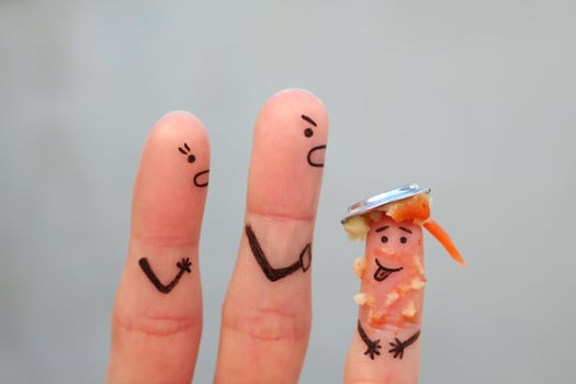 Fingers art of family during quarrel. Concept of parents scold the child because he put a plate of food on his head. photo