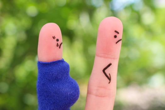 Fingers art of couple during quarrel. Concept the husband left his pregnant wife. photo