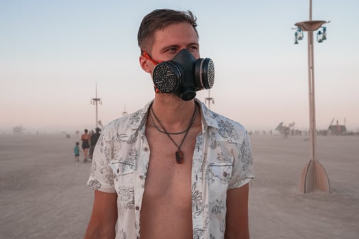 People walking towards sunset at a festival in the desert at the Burning Man Festival. photo