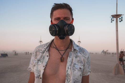 People walking towards sunset at a festival in the desert at the Burning Man Festival. photo