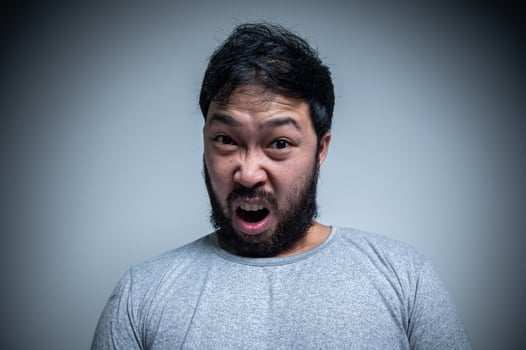 Asian handsome man angry on white background,Portrait of young Stress male concept photo