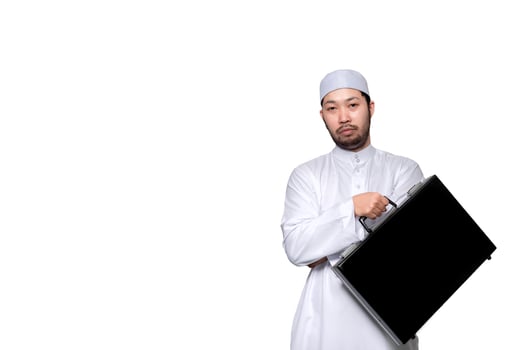 Portrait of smart handsome muslim man on white background,Ramadan festival concept,Islamic male holding a business man's bag on a white background photo