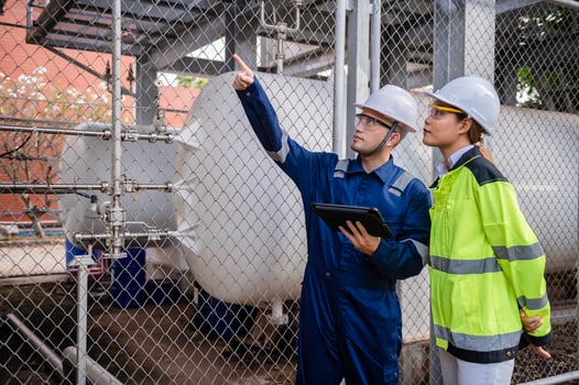 Engineers work place to keep liquid helium,preventive maintenance schedule checking,Thailand people,Technicians and engineers discuss work together. photo