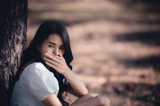 Asian beautiful girl feel alone in the forest,Sad woman concept,Thailand people,Lady sadness about love from boyfriend,She feeling broken heart photo