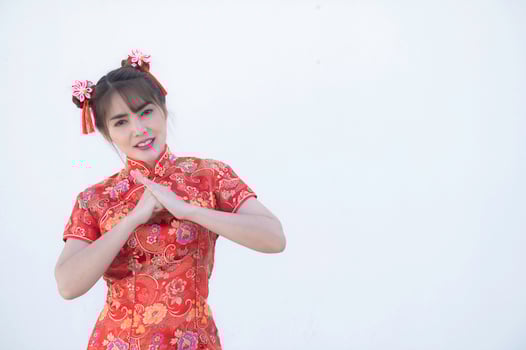 Portrait beautiful asian woman in Cheongsam dress on white background,Thailand people,Happy Chinese new year concept,Happy asian lady in chinese traditional dress photo