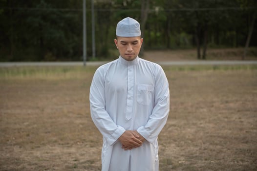 Asian white islam man prayer,Young Muslim praying,Ramadan festival concept photo