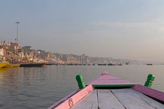 view of Varanasi city and Ganges river from a boat photo