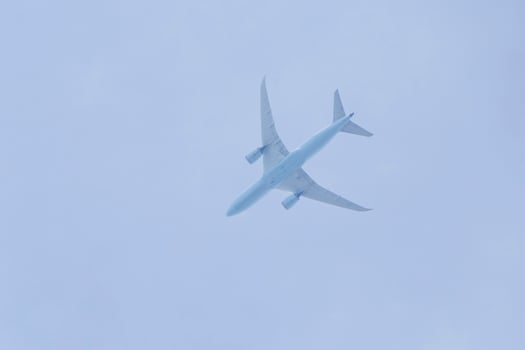 close up of aircraft flying in a sky photo