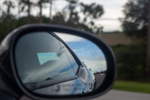 Speeding Car through a rear view mirror photo