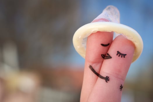 Finger art of a Happy couple. The happy couple kissing and hugging. The concept of safe sex. photo