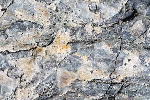 Cracked stone surface grey and brown color. Nature background or pattern texture photo
