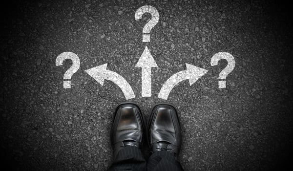 Black Business Shoes, Three Arrows and Question Marks - Problem Concept photo