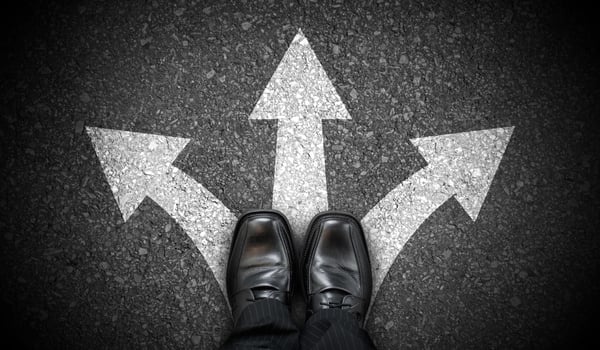 Black Business Shoes and Three Chalky Arrows on Asphalt - Decision Concept photo