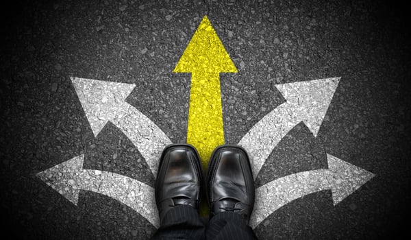 Black Business Shoes and Five Chalky Arrows on Asphalt - Choice Concept photo