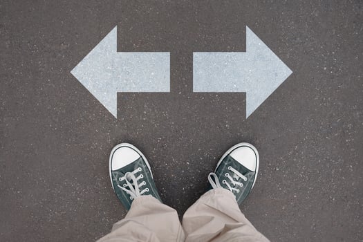 Two arrows - choice concept - legs with trainer shoes photo