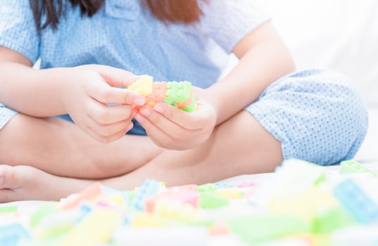 asian cute girl play block bricks on bed photo
