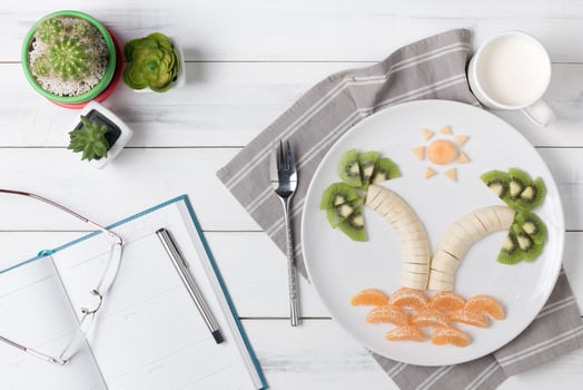 banana kiwi orange and melon on dish photo