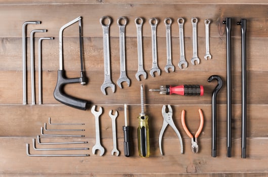 set of tools supplies  on wood background top view photo