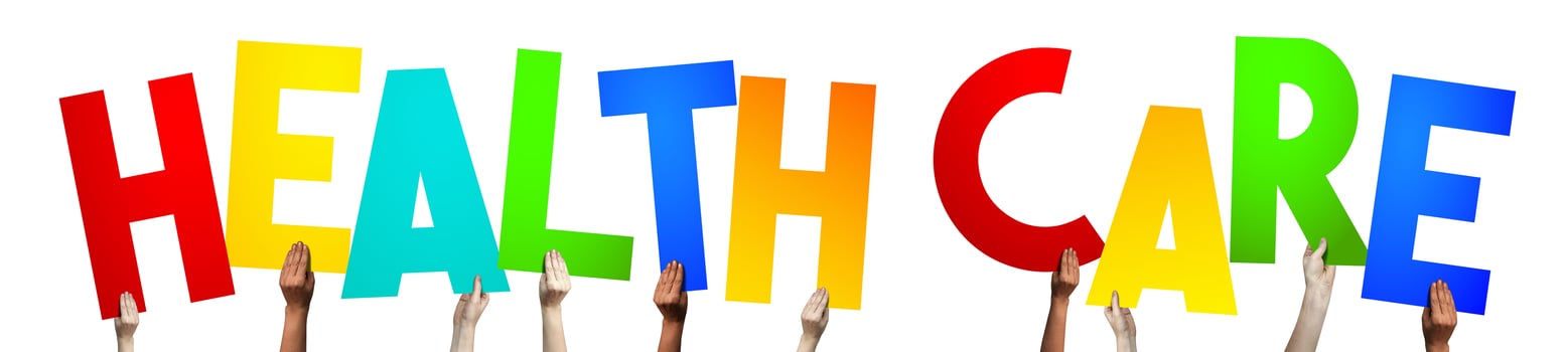 Health Care - Human Hands Holding Colorful Letters photo