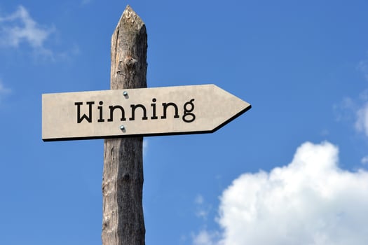 Winning - Wooden Signpost with one Arrow, Sky with Clouds photo