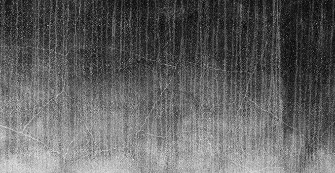 Texture black cement wall with rain stain photo