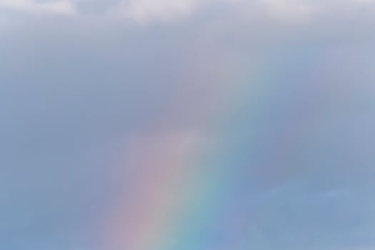 rainbow in a cloudy sky photo