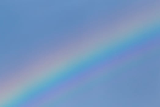 rainbow in a blue sky photo