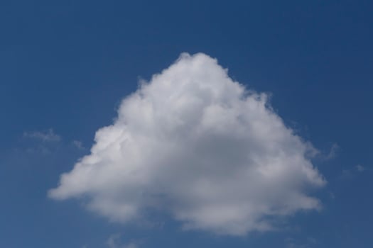 white cloud looking like pyramid in a blue sky photo