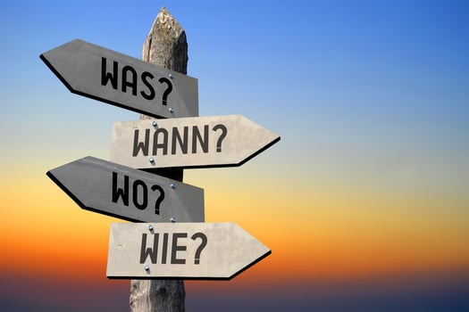 What, When, Where, How in German - Wooden Signpost photo