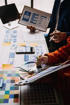 Close up ux developer and ui designer use augmented reality brainstorming about mobile app interface wireframe design on desk at modern office.Creative digital development agency photo