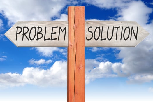 Problem or Solution - Wooden Signpost with Two Arrows and Cloudy Sky photo