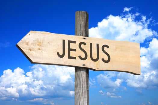 Jesus - Wooden Signpost with one Arrow, Sky with Clouds in Background photo