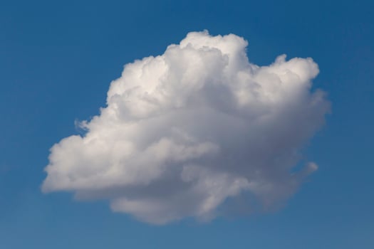 white fluffy cloud in a blue sky photo