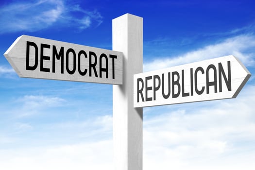 Democrat, Republican - Wooden Signpost with Two Arrows and Sky in Background photo