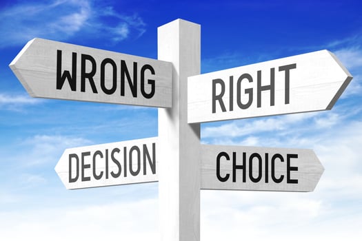 Choice Concept - Wooden Signpost with Four Arrows and Sky in Background photo