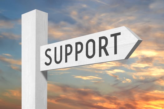 Support - White Wooden Signpost with one Arrow and Sunset Sky in Background photo