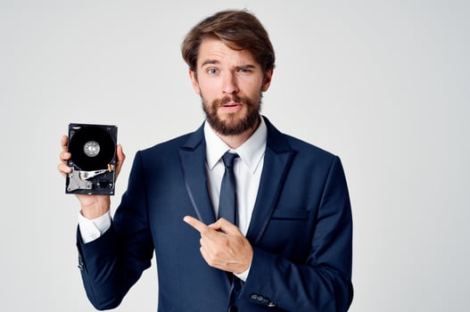 a man in a suit technology hard disk information photo